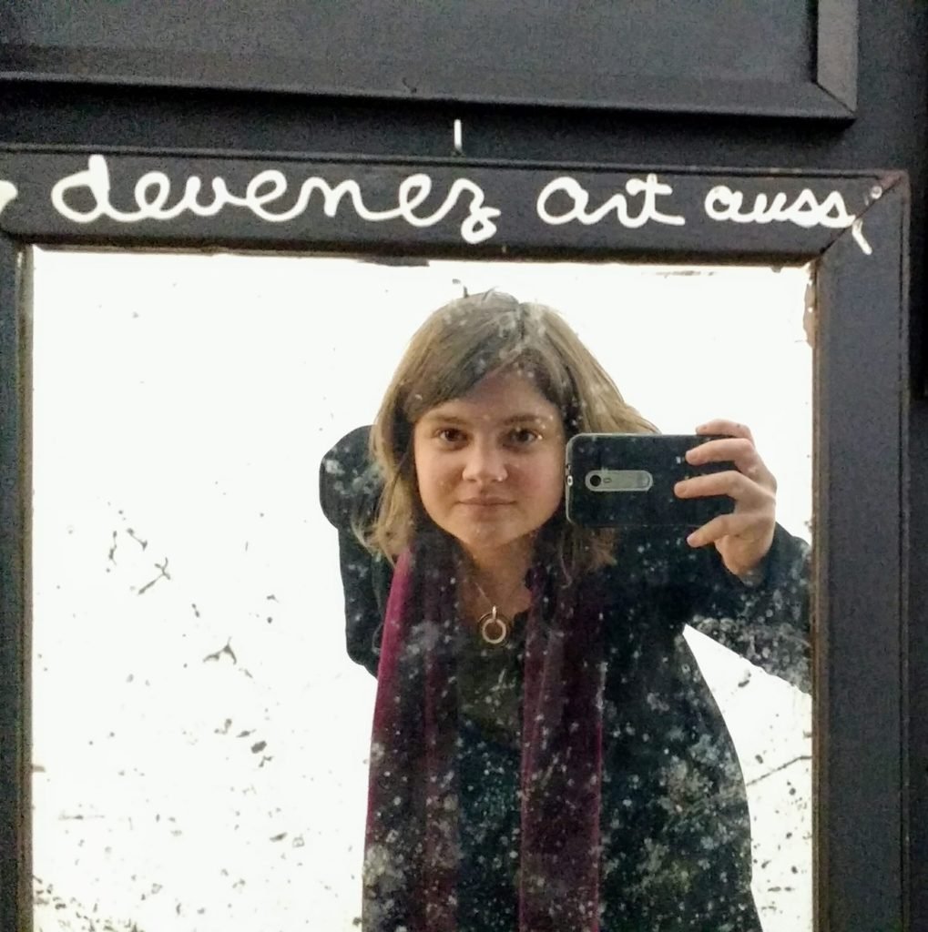 Kris taking a mirror self-portrait while travelling